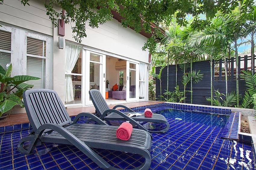 Sun bed near swimming pool with property Villa Hutton 214 in Koh Samui 
