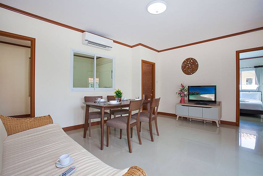 Living area with TV Timberland Lanna Villa 302 in Bangsaray Pattaya