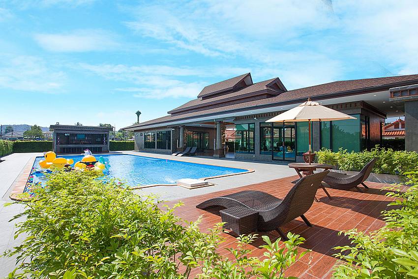 Sun bed neaw swimming pool Timberland Lanna Villa 305 in Bangsaray Pattaya