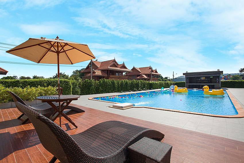 Sun bed near swimming pool Timberland Lanna Villa 306 in Bangsaray Pattaya