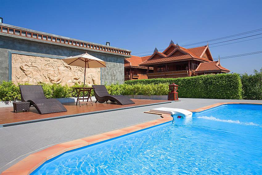 Sun bed near swimming pool Timberland Lanna Villa 401 in Pattaya