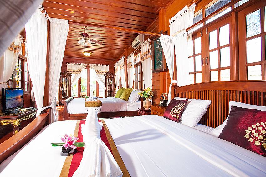 Bedroom with TV Timberland Lanna Villa 201 in Bangsaray Pattaya 