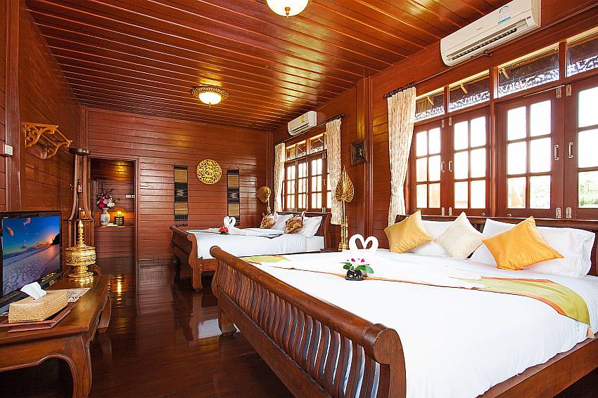 Bedroom with TV Timberland Lanna Villa 202 in Pattaya