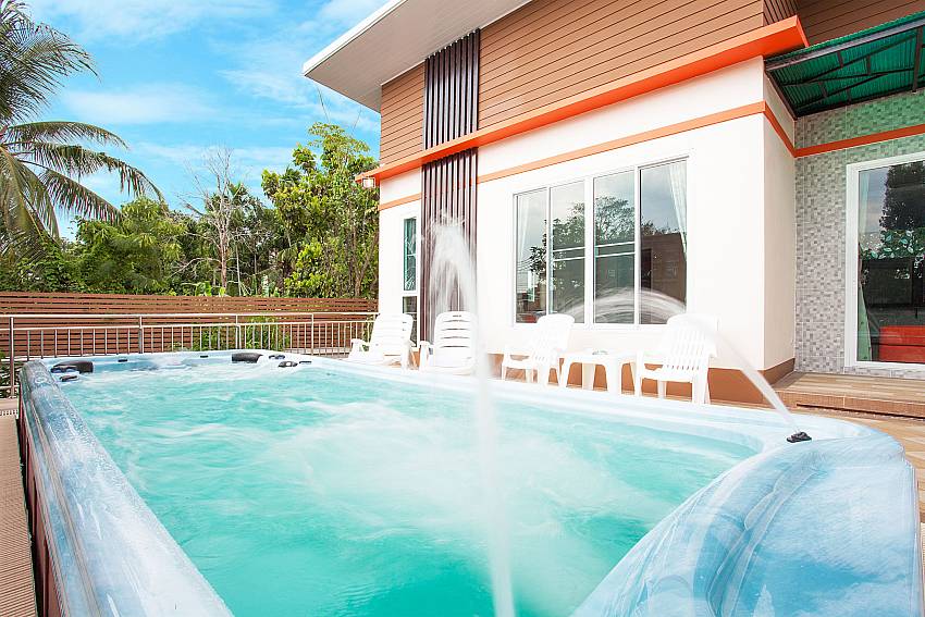 Sun bed near jacuzzi Melodious Villa in East Pattaya