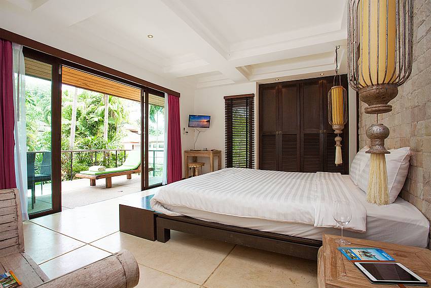 Master bedroom with view and TV in Nirano Villa 24 Kathu Phuket