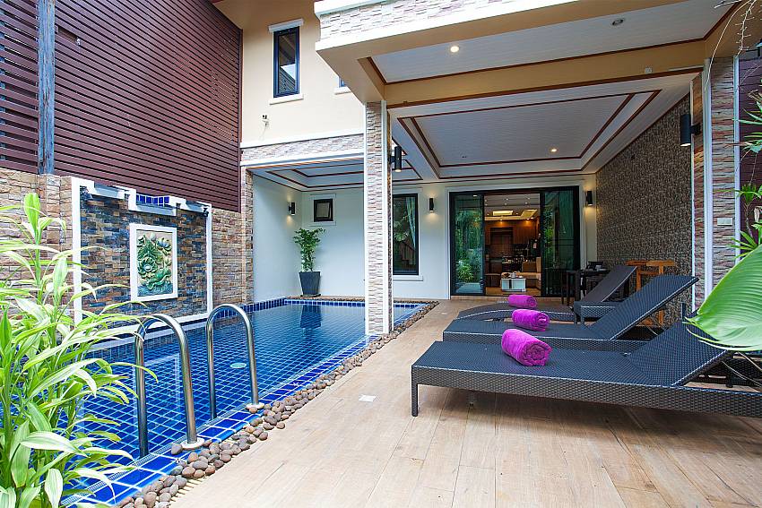 Sun bed near swimming pool with property BangTao Tara Villa 5 in Phuket