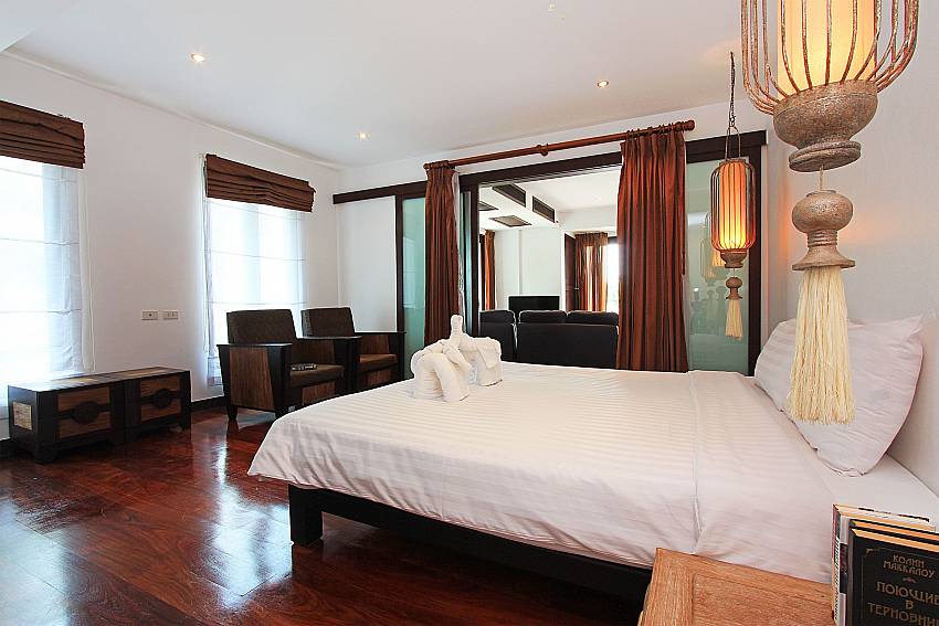 1. kingsize bedroom with lounge in the back at Nirano Villa 41 Phuket