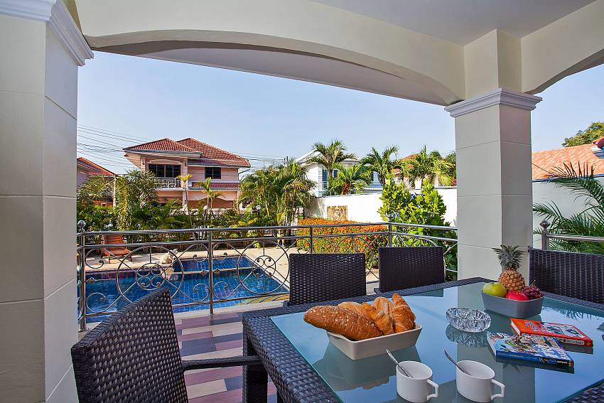 Outdoor dining table with pool view Baan Kinara Jomtien Pattaya