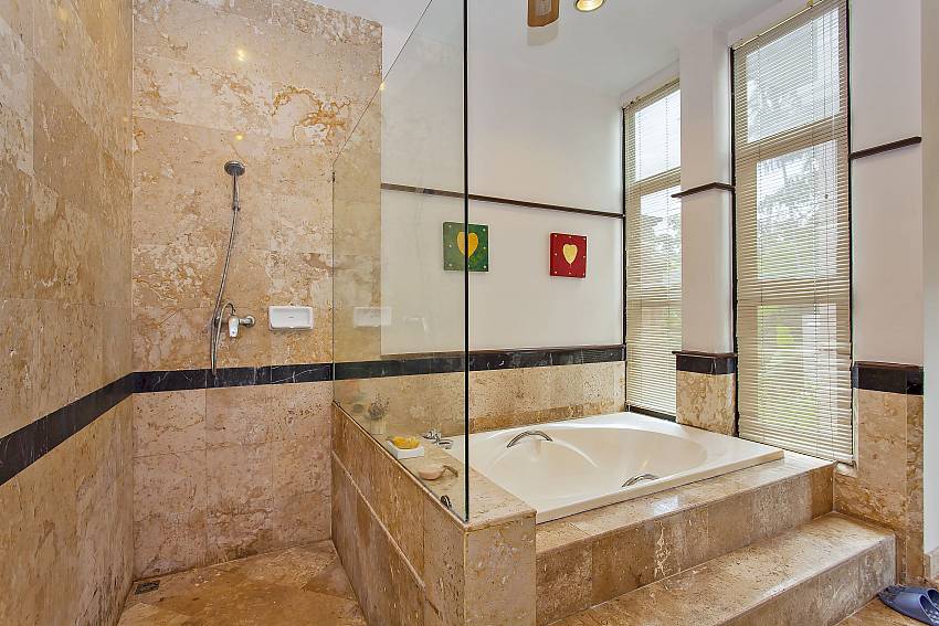 1. en suite bathroom with tub and shower at pattaya Villa Klasse