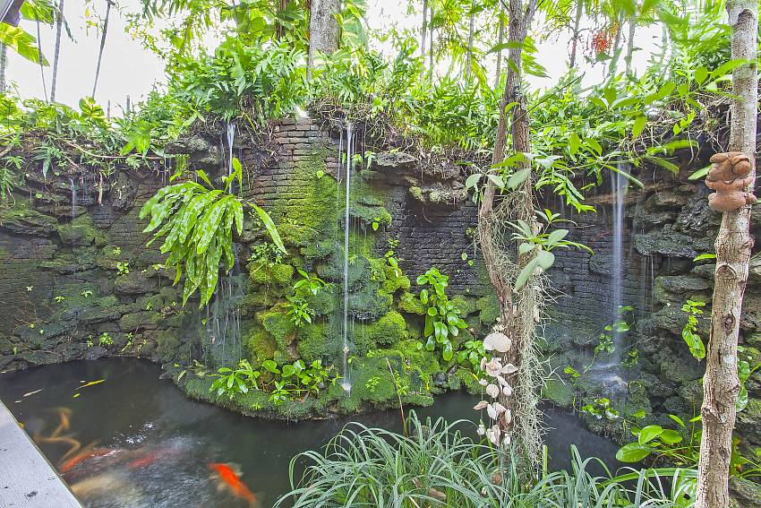 fish pond with waterfall in the tropical surrounding of Villa Klasse pattaya