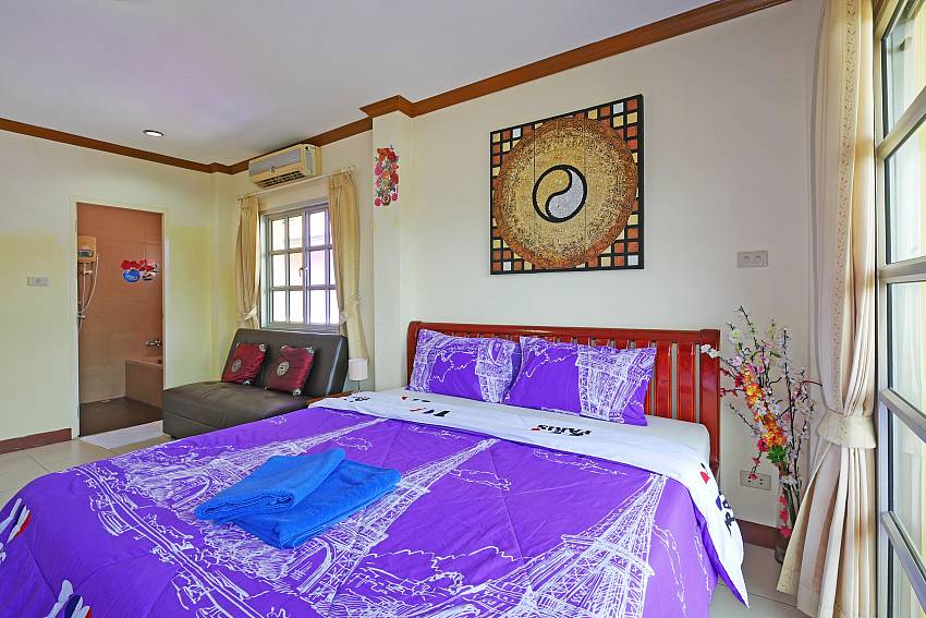 Master bedroom with king-size bed at Villa Amiya South-Pattaya