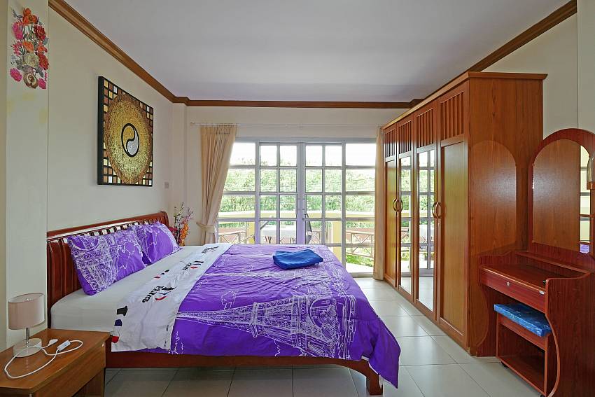 1. kingsize bedroom with private balcony at Villa Amiya in Pattaya