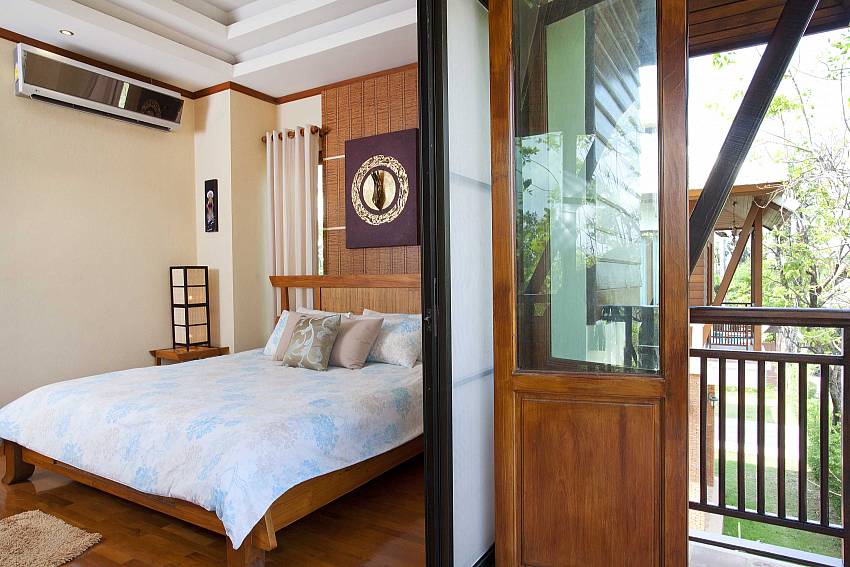 First bedroom with balcony Of Baan Suay Tukta
