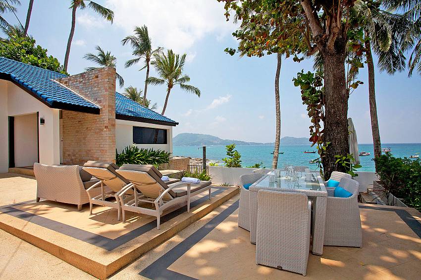 Dining table outdoor overlooking the sea Of Kalim Bay Villa