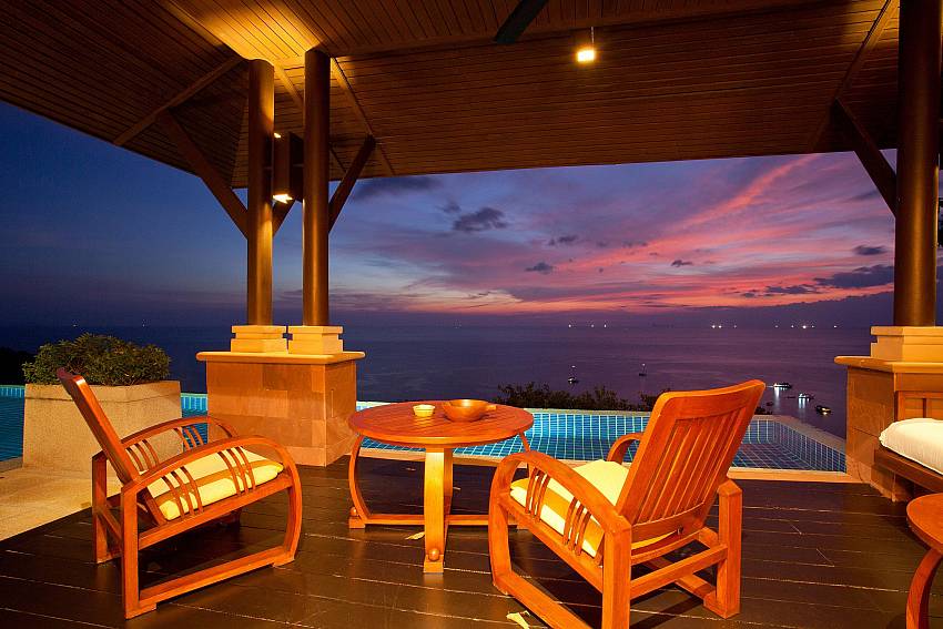 Coffee table on balcony at night time Of Pimalai Pool Villa Luxury