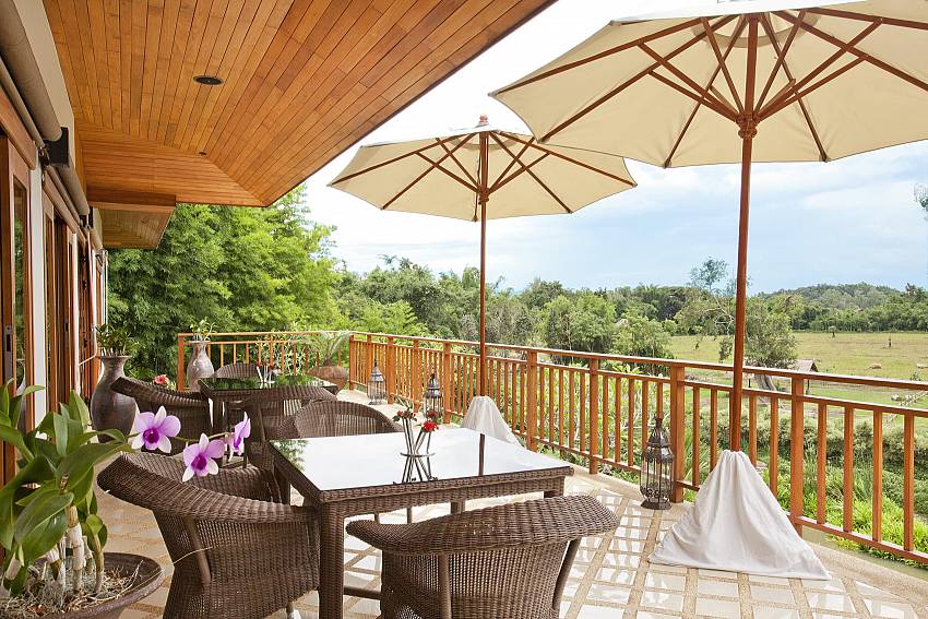 Coffee table on balcony Of Teak Villa Suandok