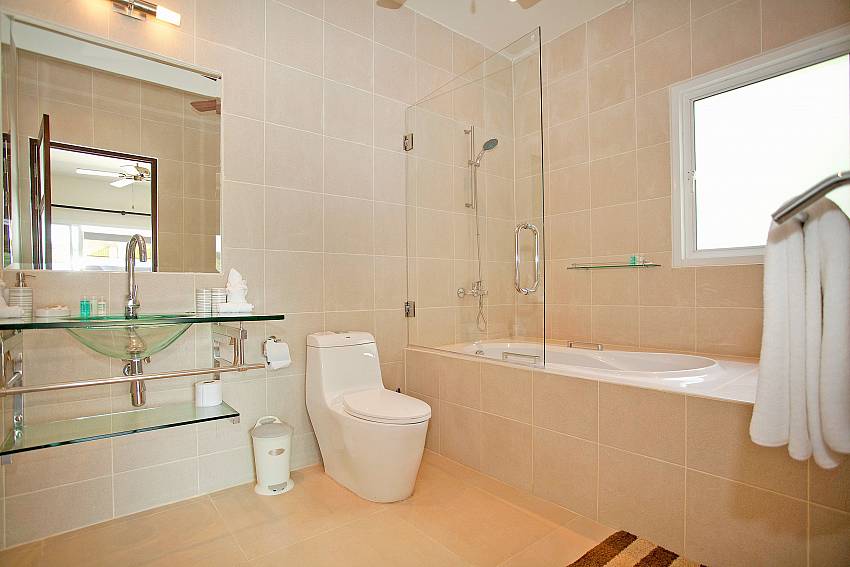 Some bathrooms have bath tubs at Villa Ampai South Phuket