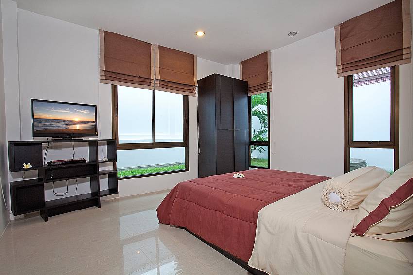 Bedroom views with TV and shelves Of Chalong Sunshine Villa (Second)