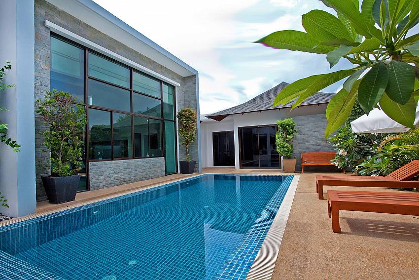 Swimming pool outdoor with sun bed Of Chalong Sunshine Villa