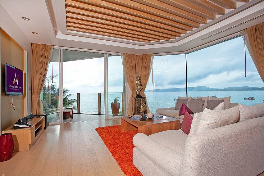 Living room with TV overlooking the sea Of Bang Tao Beach-Front Penthouse