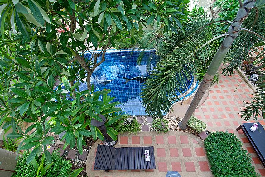Top view down below overlooking the pool and trees Of Villa Pratumnak Elite