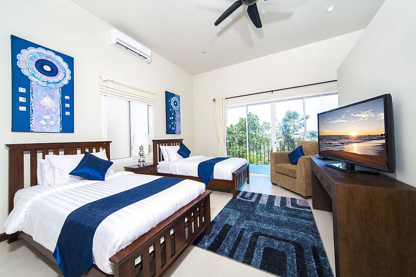 Double bedroom with TV and sofa near the pool Of Villa Hin Fa (First)