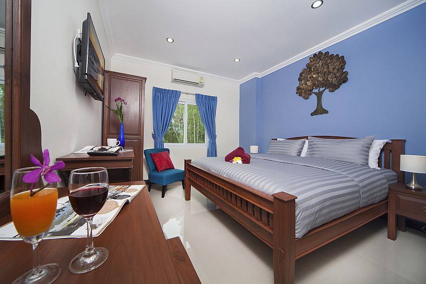 Blue Bedroom views with vanity and TV Of Baan Calypso (Third)