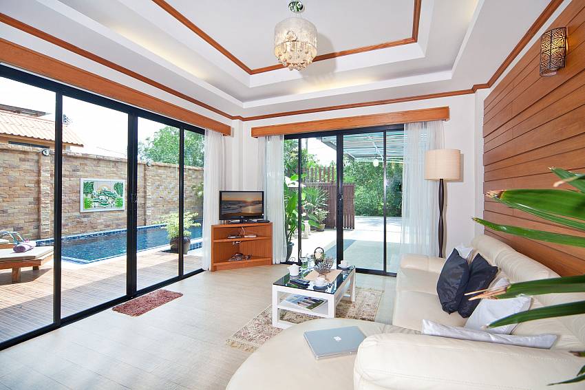 Living room with TV near the pool Of BangTao Tara Villa 2