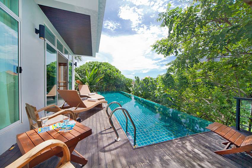 Sun bed by the pool Of Karon Hill Villa 12