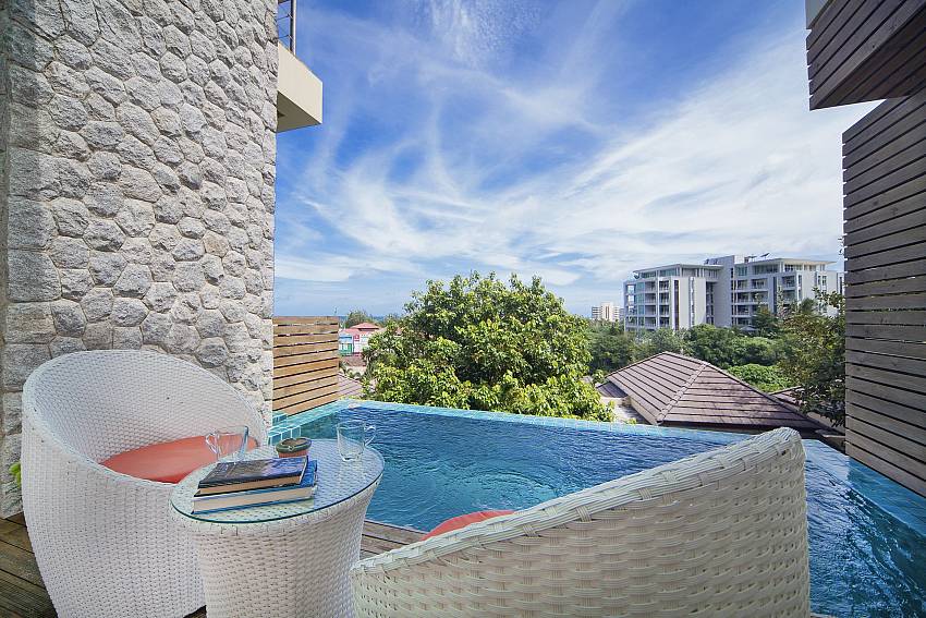 Lounging by the pool Of Karon Hill Villa 20