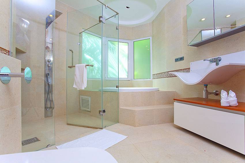 Bathroom with jacuzzi tub and basin wash Of Ocean Fringe Apartment A