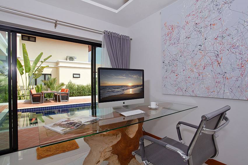 Working table with pool view at Villa Oranuch Pattaya