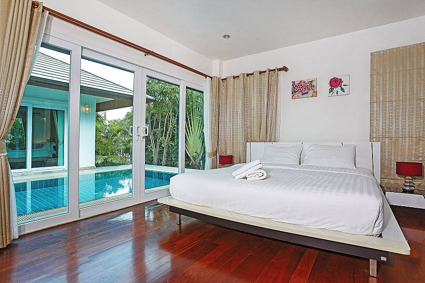 King-size bedroom with direct pool access at Rossawan Pool Villa Pattaya