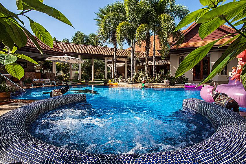 Swimming pool at daytime Of Relaxing Palms Pool Villa