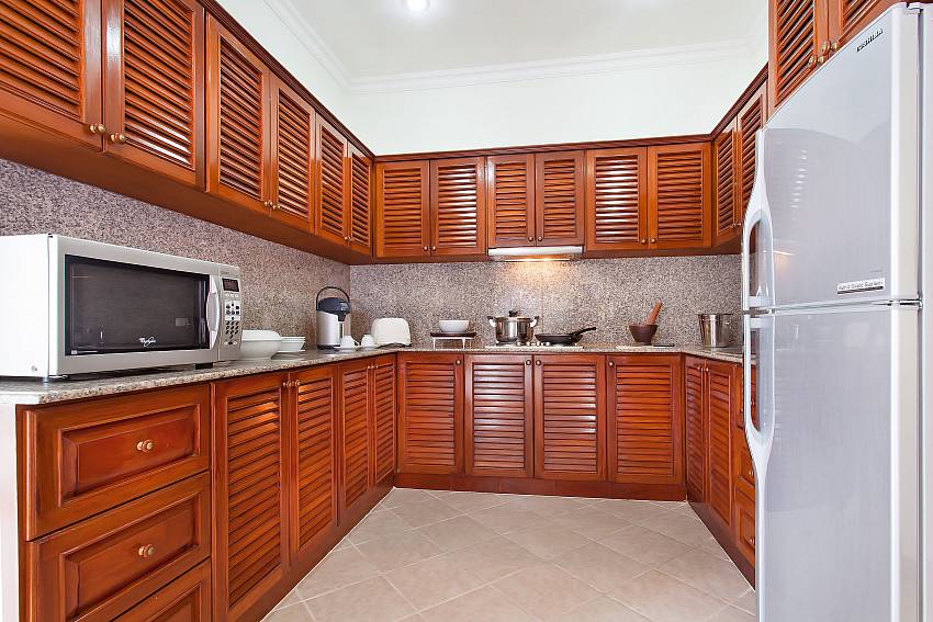 Kitchen with refrigerator and microwave Of Serene Pool Villa