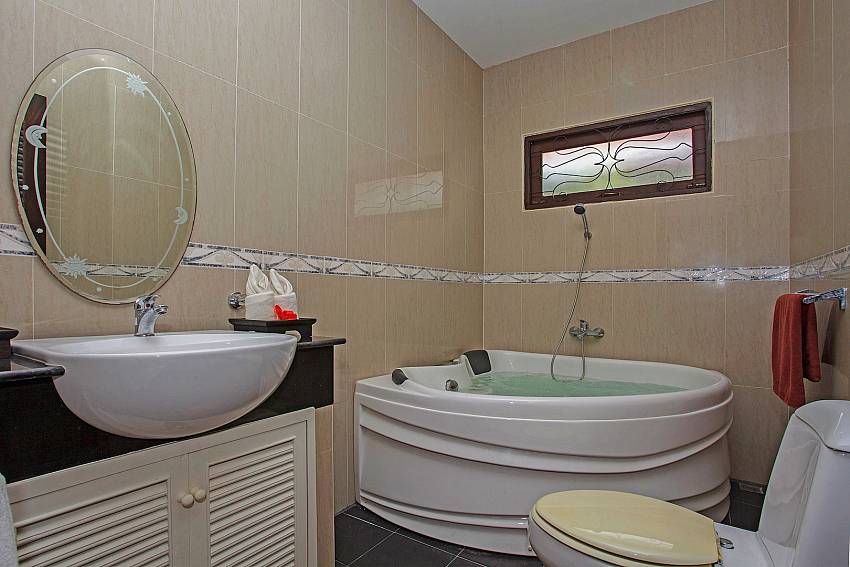 Toilet with jacuzzi tub and basin wash of Tranquillo Pool Villa