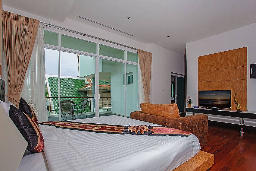 Bedroom with TV and sofa of Kata Horizon Villa A1