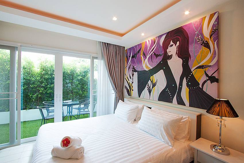 King size bedroom with direct pool access at Fantasia Apartment Pattaya