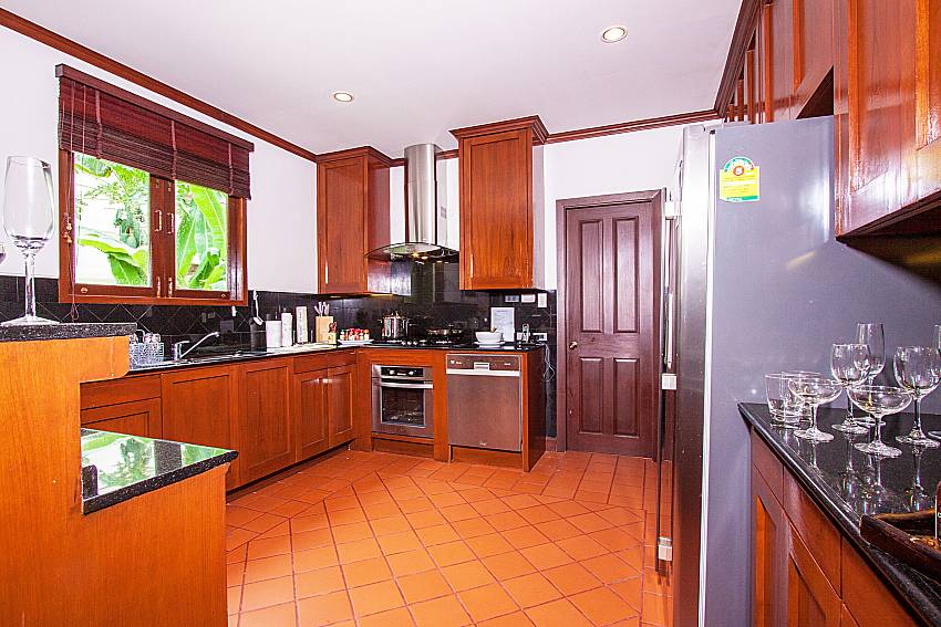 Kitchen room with refrigerator of Baan Pasana