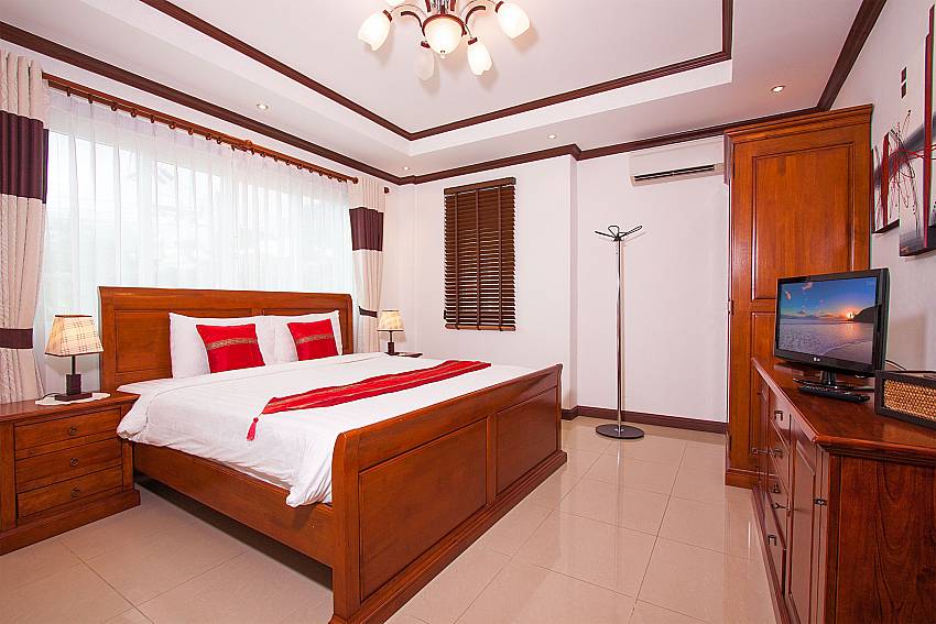 King size bedroom with TV at Baan Sanun 2 in Patong Phuket