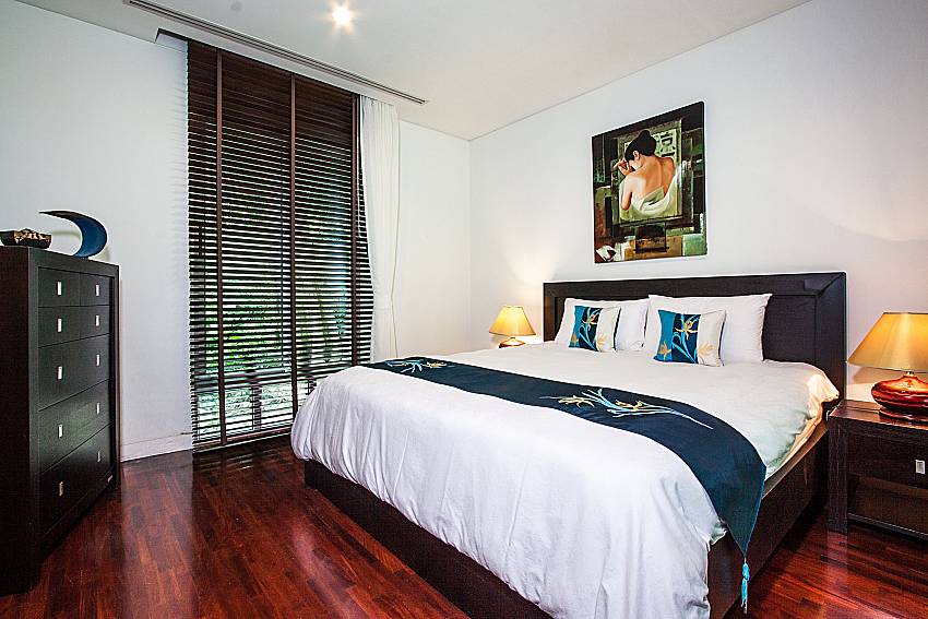 Bedroom is decorated with pictures of Churai Condo