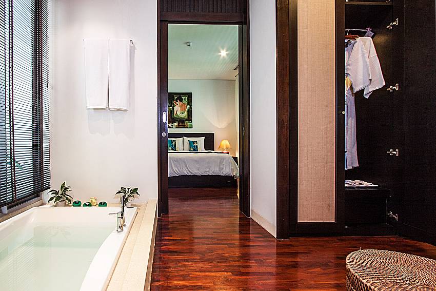 Jacuzzi tub near the wardrobe of Churai Condo